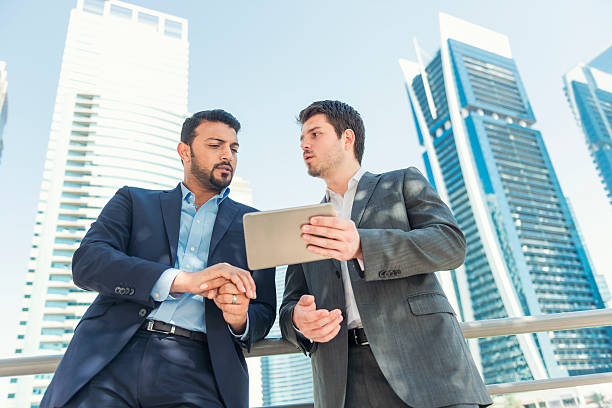 Person handing over cash for agent fees in Dubai real estate